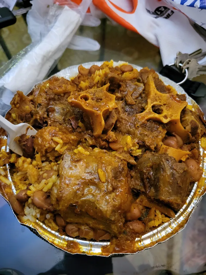 Oxtails over rice and beans